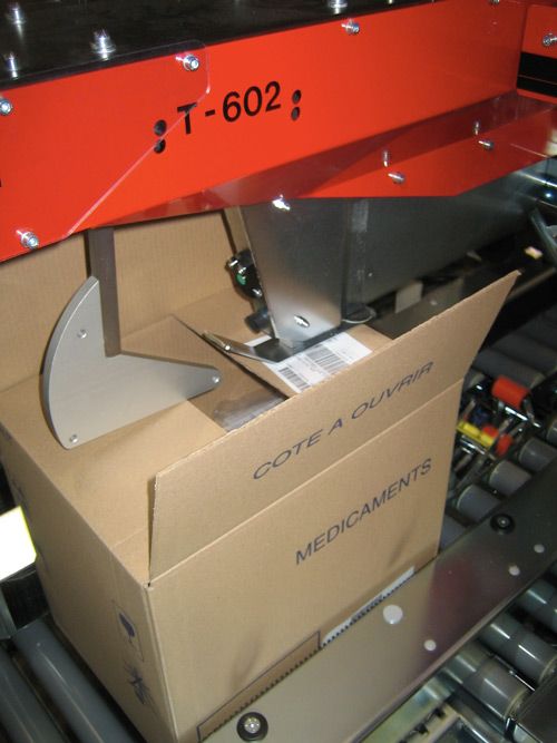 Système de pliage des rabats de caisses carton en automatique
